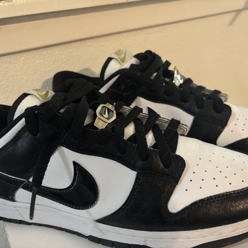 Nike Black and White Sneakers with Gold Accents - Picture 2 of 5